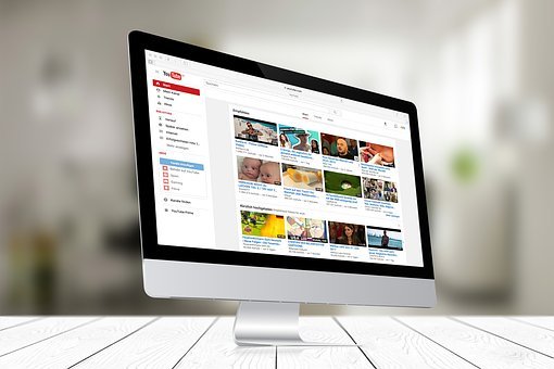 A computer monitor shows a page from YouTube on its screen.